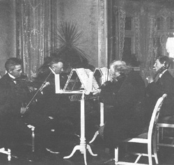 Carl Nielsen, Gerard von Brucken Fock, Julius Rontgen and his son Engelbert play string quartet at Fuglsang